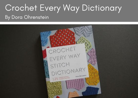 Crochet Every Way Stitch Dictionary by Dora Ohrenstein lies on a grey background.  The front cover has the title on a white rectangle and multi-coloured swatches of crochet underneath.  