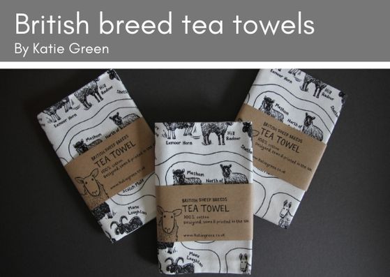 Three Katie Green folded white cotton tea towels printed with black and showing all 72 British sheep breeds.  Each tea towel has simple brown paper packaging around it.