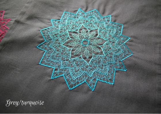 Grey mandala project bag: a close up of a grey cotton bag with a turquoise mandala fading from a dark outside to lighter inner.