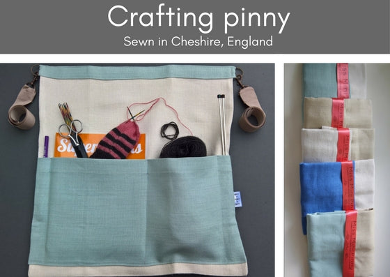 Left photo shows a linen crafting pinny in an aqua blue and bleached/bone linen.  The pockets are full of a knitting book, partially knitted sock, needles, scissors.  At eth sied of the pinny are clips with natural coloured ribbons to tie it around your waist.  The photo to the right shows the selection of colours available through a range of pinnies piled on top of each other.